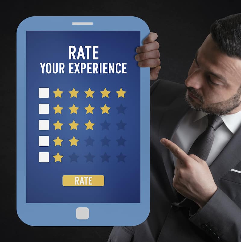 man holding tablet that says rate your experience
